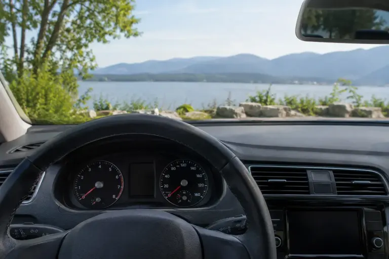 A parked car dashboard viewed from the driver seat.